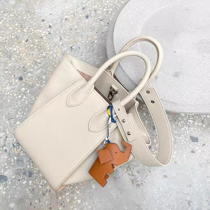 

New lychee pattern basket children wing bag leather bucket bag niche design temperament portable shoulder bag