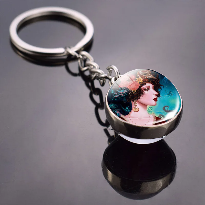 Металлический брелок серебряного цвета элегантный двусторонний прозрачный