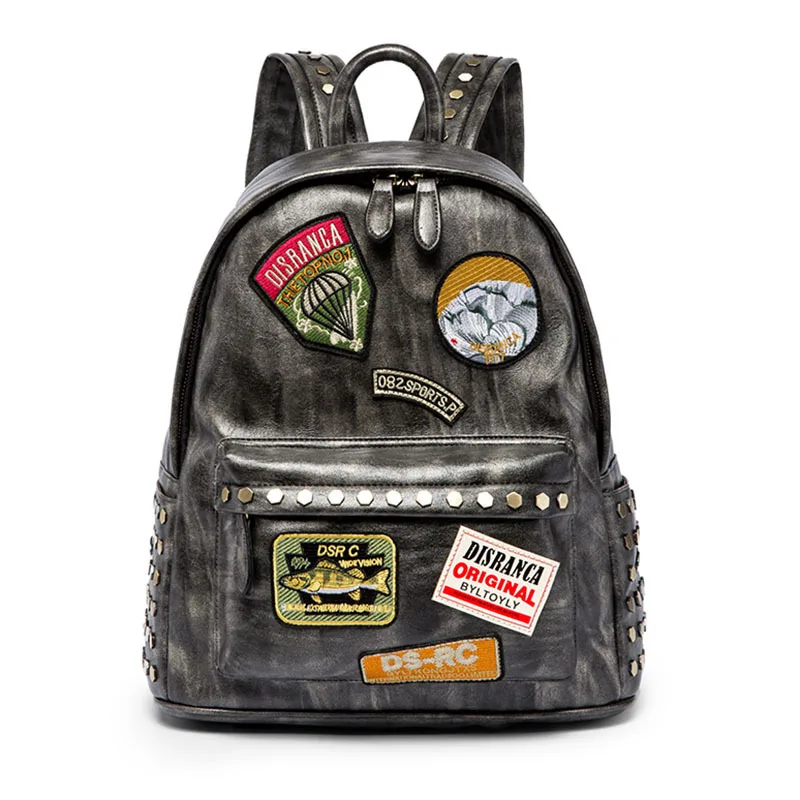 

2020 new Korean personalized rivets men's medal backpack simple and versatile waterproof PU Leather travel backpack