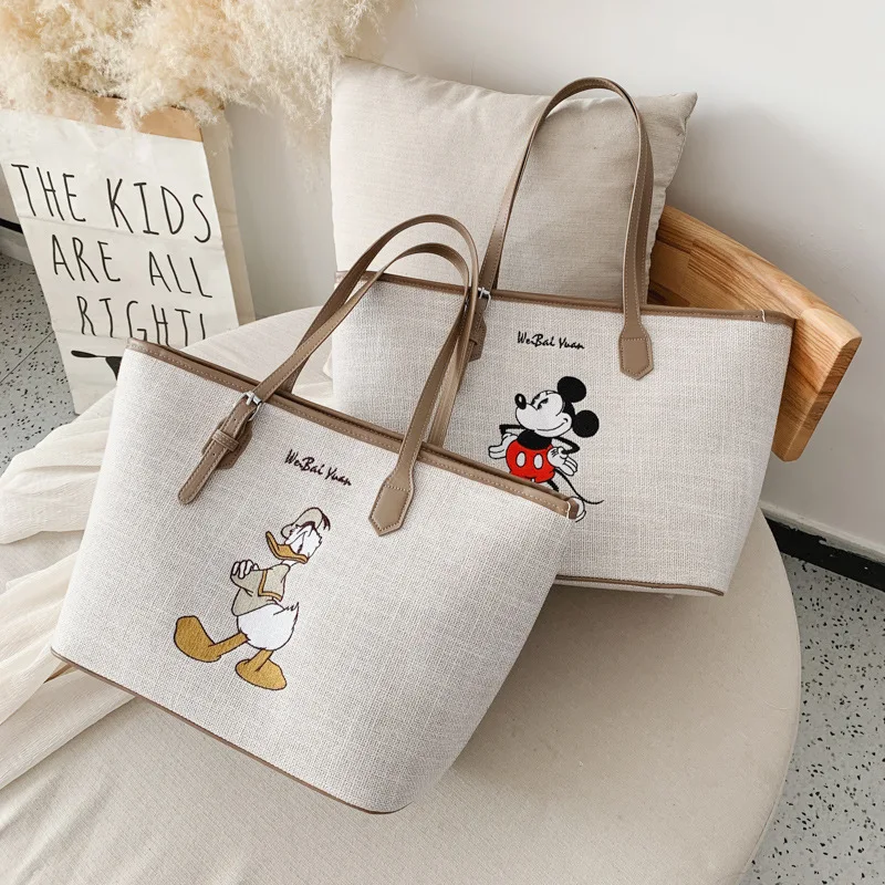 

Disney Minnie High capacity handbag women Canvas bag female 2020 Tote bag cartoon bag Mickey shoulder portable shopping bag gift