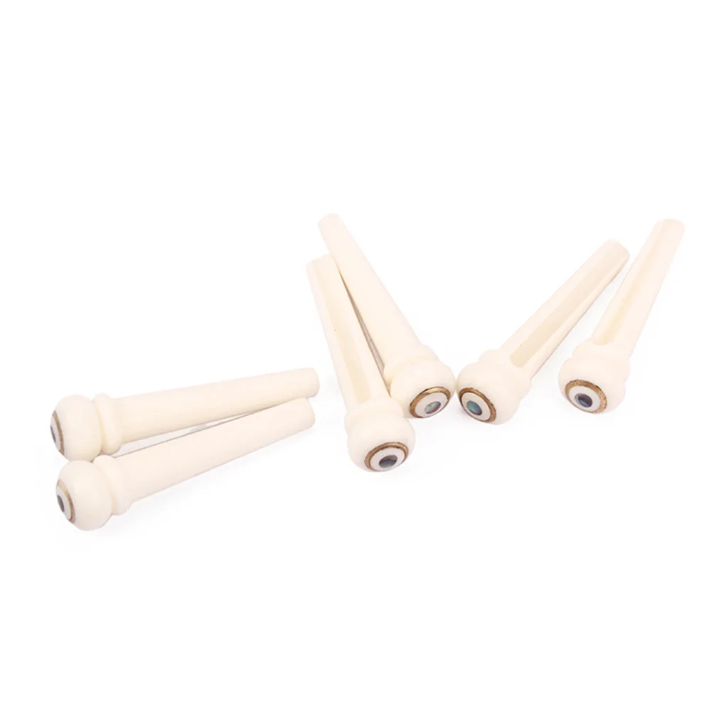 

6pcs Bone Guitar Bridge with Brass Circle and Green Pearl Shell Dot String Nails Pin(GL92,Ivory)