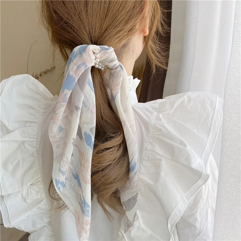 

Korean version of pearl hair accessories a variety of wearing methods concave hair ring fairy streamer hair ring hair rope girl