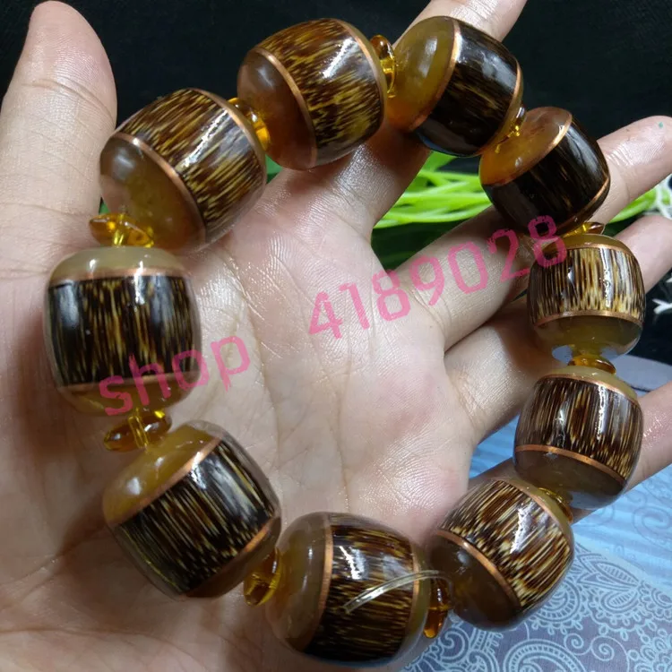 

Natural dragon blood gold wire bamboo inlaid sheep horn bracelet, handicraft ornaments