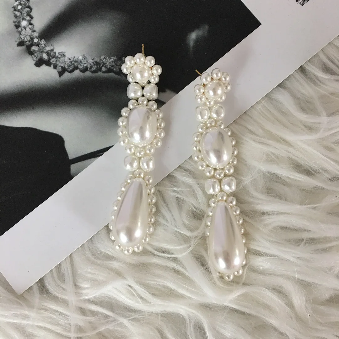 

The same hand-woven high-end pearl earrings earrings, all-match temperament