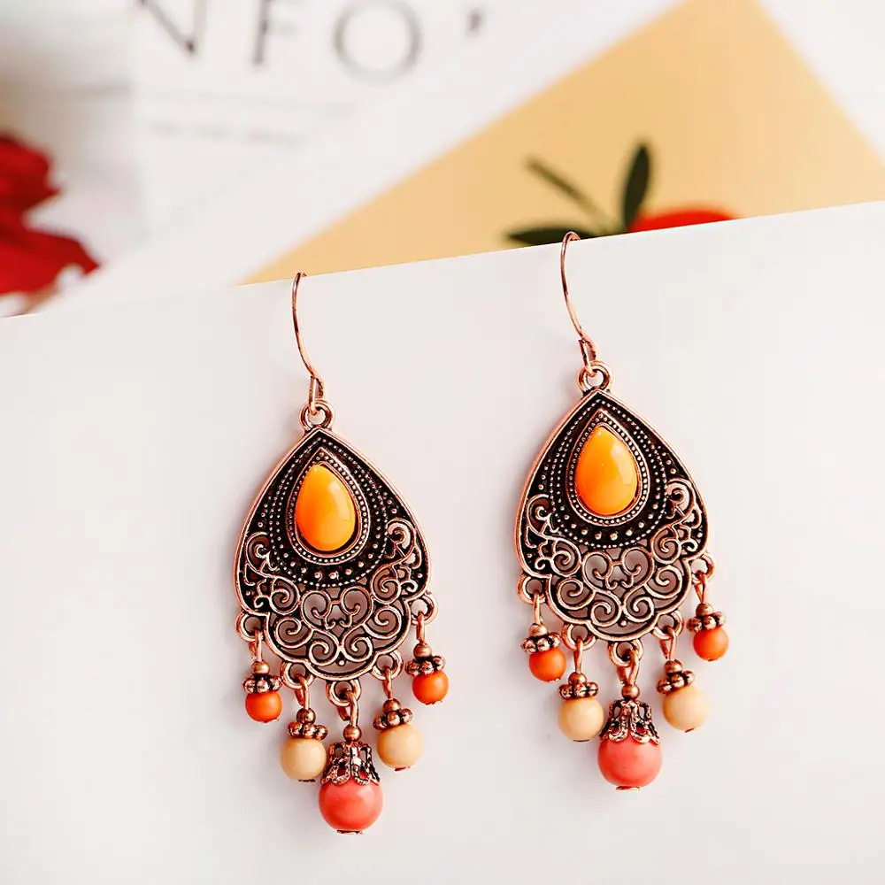 

Vintage Bohemian Style Fashion Pendant Earrings Drop Shaped Copper Hollow Geometric Pattern Pendant Orange Bead Earrings 2023