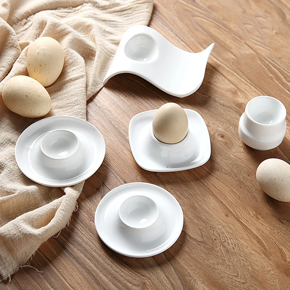 

4pcs Ceramic Egg Cup Creative Breakfast Egg Holder Practical Egg Stand Egg Rack Home Restaurant (White)