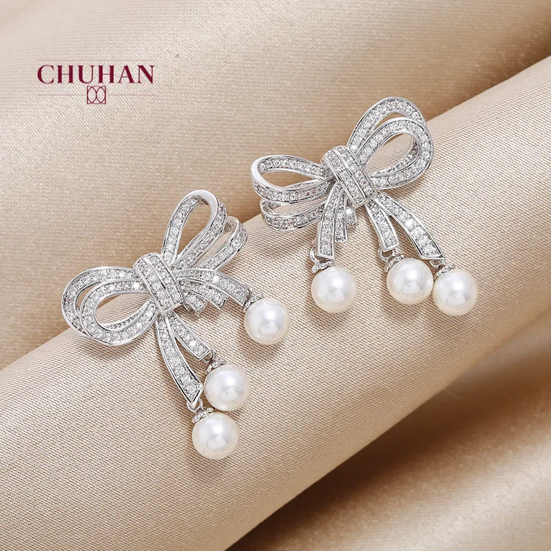 Женские серьги-гвоздики в виде банта золотого и серебряного цвета | Украшения