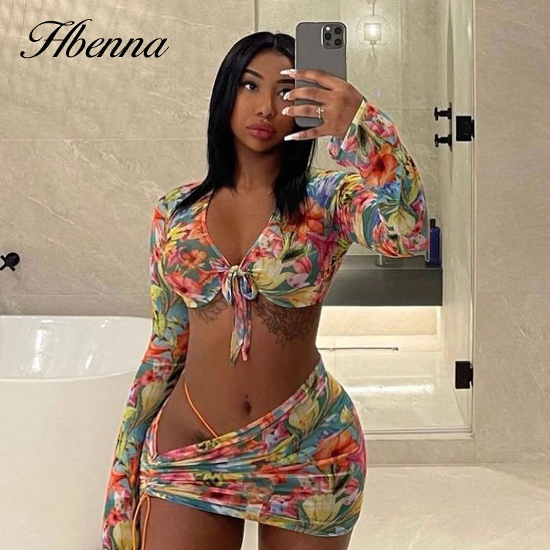 

Hbenna Mesh Two Piexes Sets Women Floral Print Sexy Mini Skirts With Body Sets Crop Tops Long Sleeve V-Neck Lace up Transparent