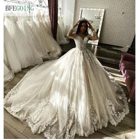 luxurious ivory lace tulle long sleeves floor length ball gown wedding dress chapel train custom made