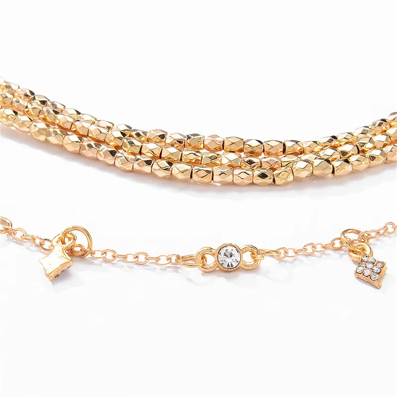 Женское многослойное колье чокер золотистого цвета с подвеской в виде звезды из