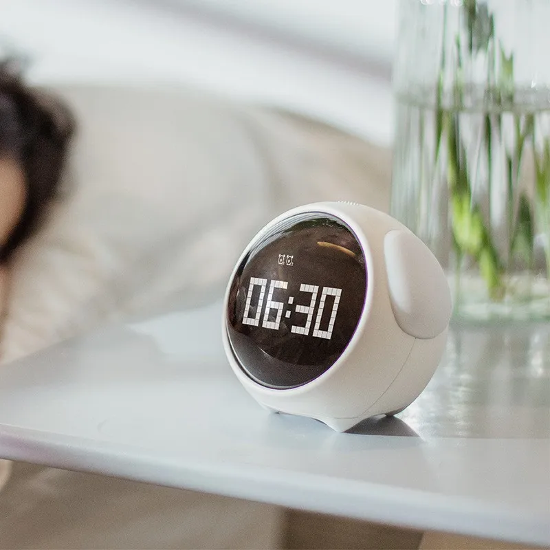 

2021 New Cute Expression Alarm Clock Multifunctional Bedside Voice Control Night Light Snooze Chargeable Child Alarm Clock
