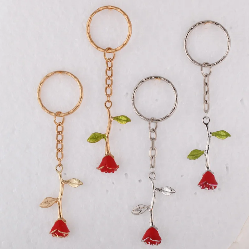 Брелок золотого цвета с эмалью в виде листа розы|Брелоки| |