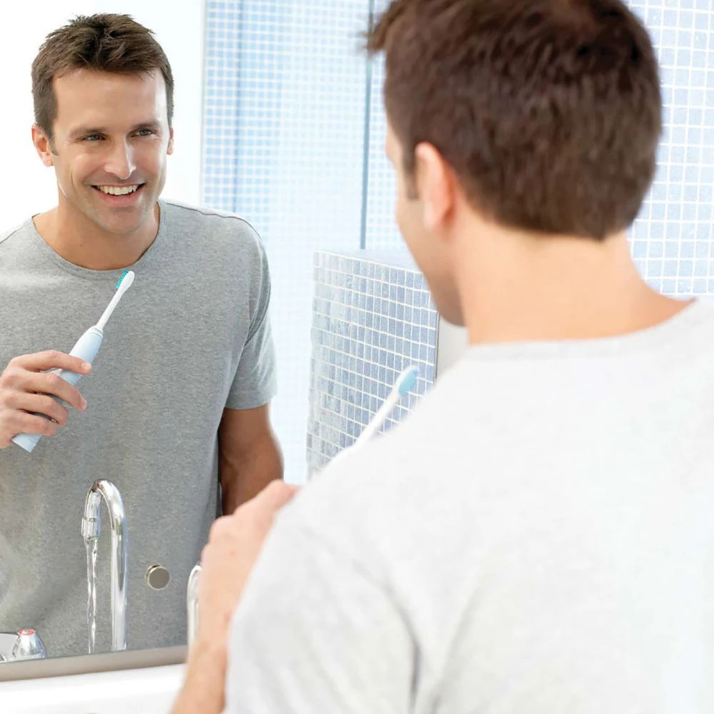 Электрическая зубная щетка Philips Sonicare HX6972/10 Smartimer и Quadpacer белого серебристого цвета