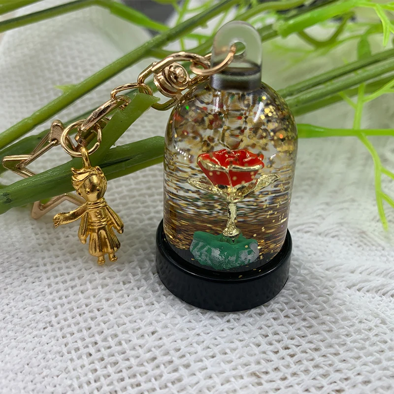 

Брелок с изображением симпатичного Маленького принца, розы, ювелирные изделия для женщин, подвеска для сумки, подвижный брелок с жидкостью ...