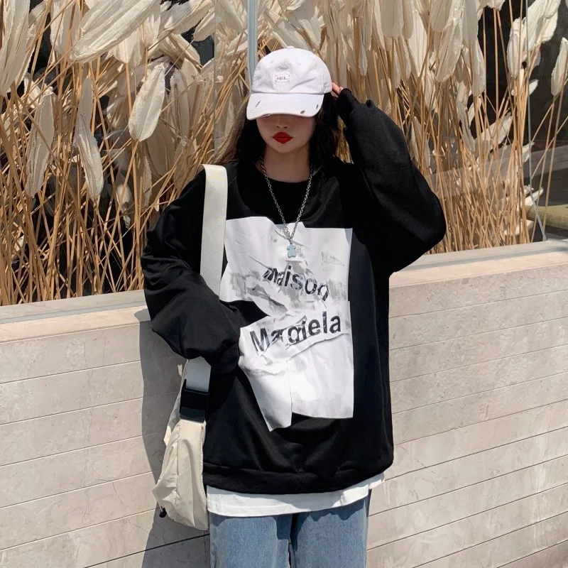 

Женский свитер средней длины с длинными рукавами и круглым вырезом