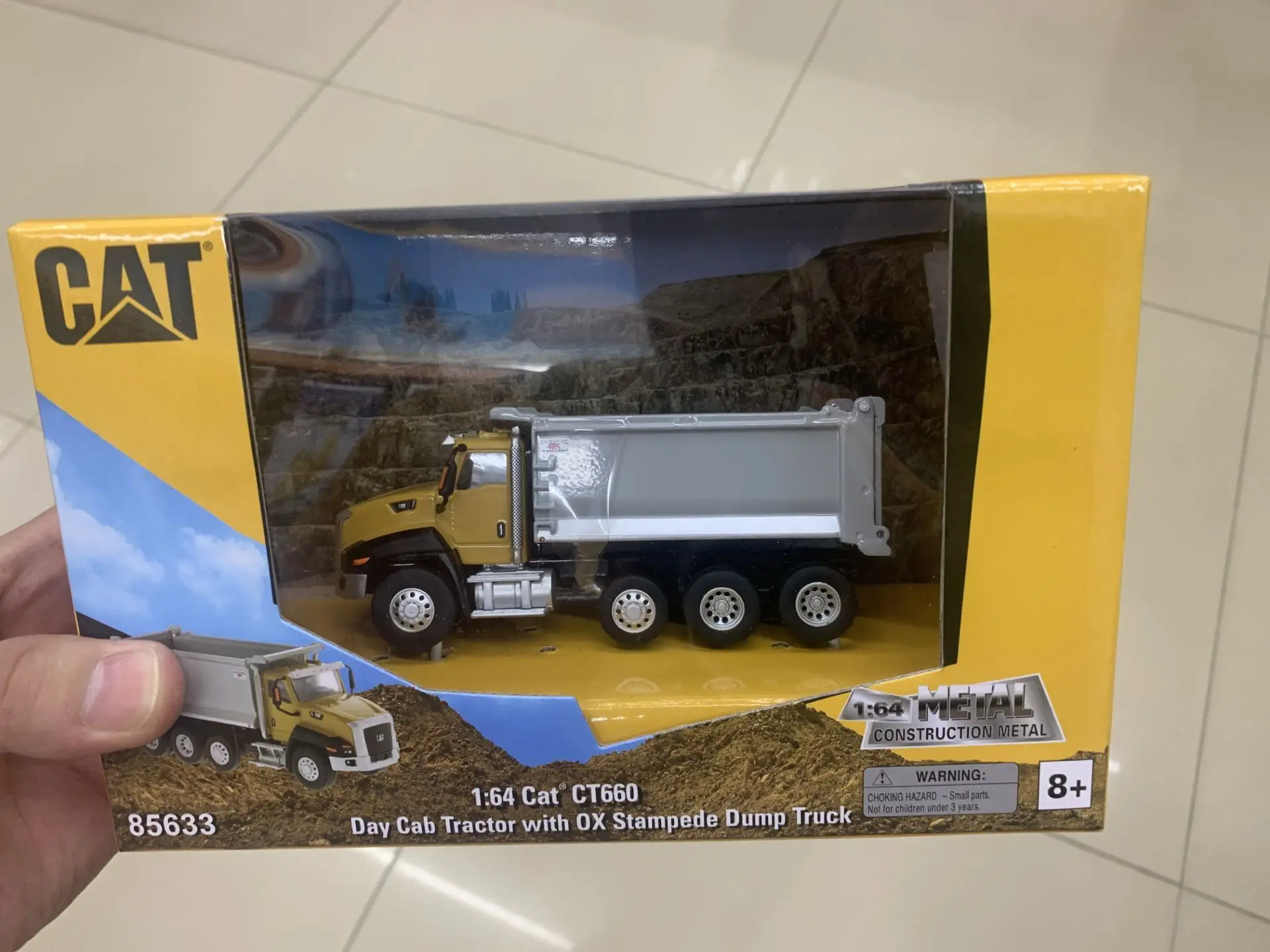 

Caterpillar Cat CT660 Day Cab Tractor With OX Stampede Dump Truck 1/64 Scale DieCast Model DM85633 New in Box