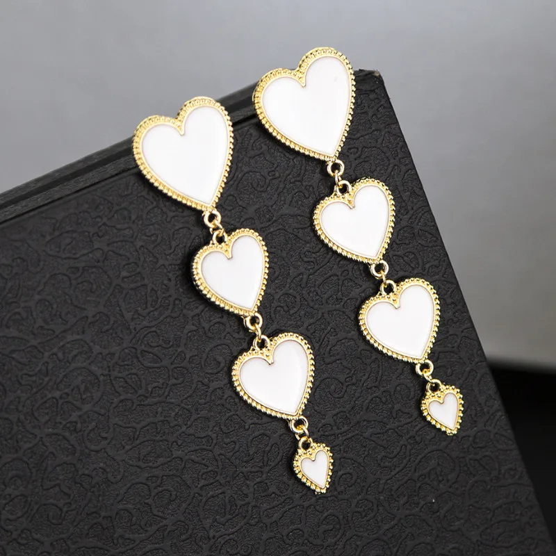 

Long Creative Temperament Four Layer Heart Shape Pendant Earrings