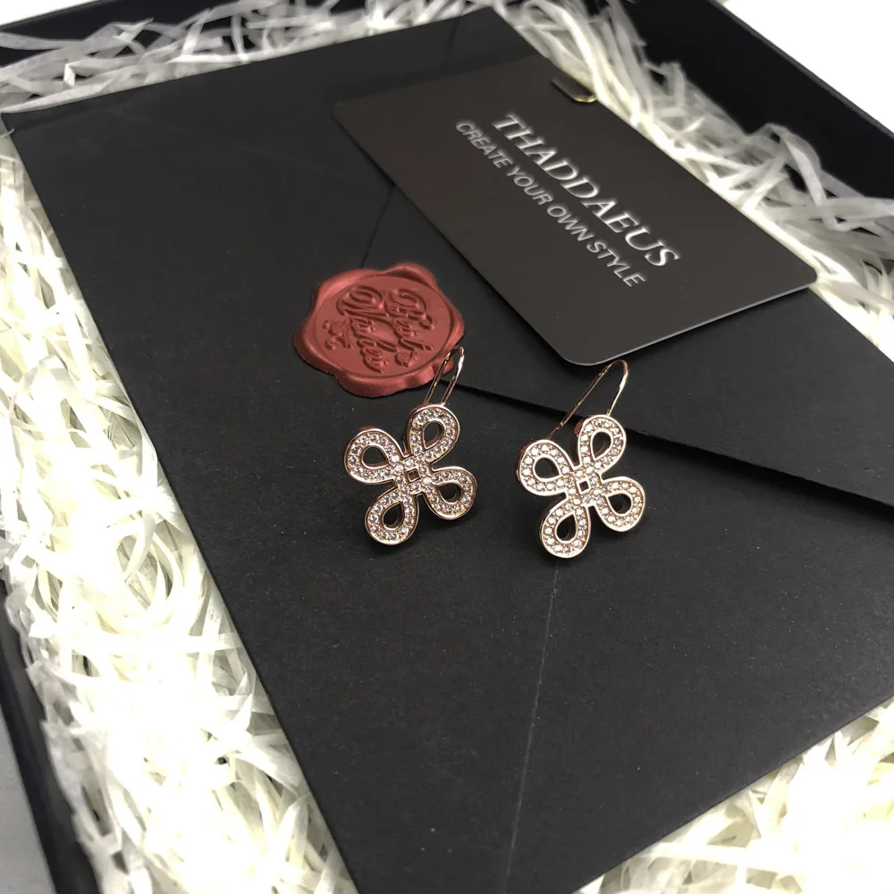 Серьги подвески в виде любовного узла цвета розового золота романтические