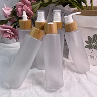 empty 100pcs flat shoulder matte plastic bottle with bamboo cap cosmetic container travel kits portable pet shampoo lotion jar