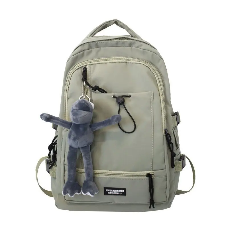 

Handsome cool boys and girls solid color student schoolbags new multi-layer large capacity funny plush pendant backpack