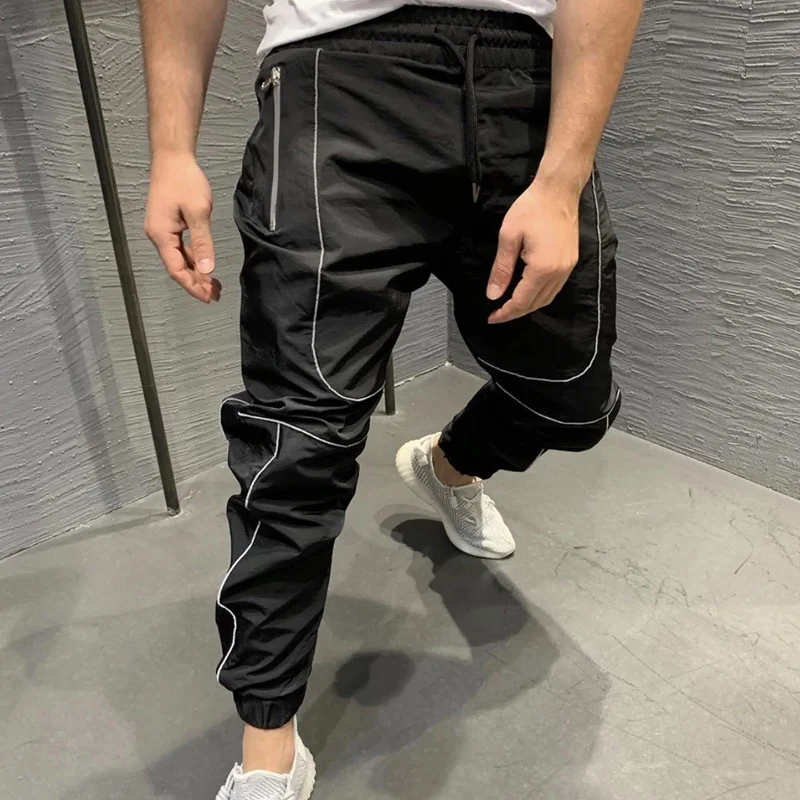 Мужские светящиеся штаны для спортзала тренировочные на молнии с карманами