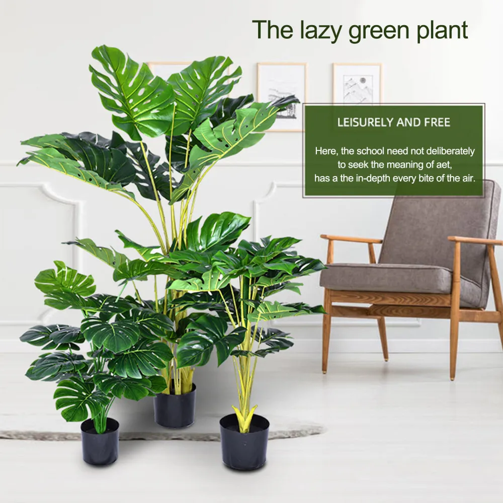 Зеленые растения искусственные пальмы деревья украшенные современным подарком