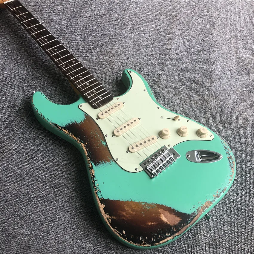 

Stock, used electric guitar, green, green guard. White hardware. Real photos, wholesale and retail, can be modified and customiz