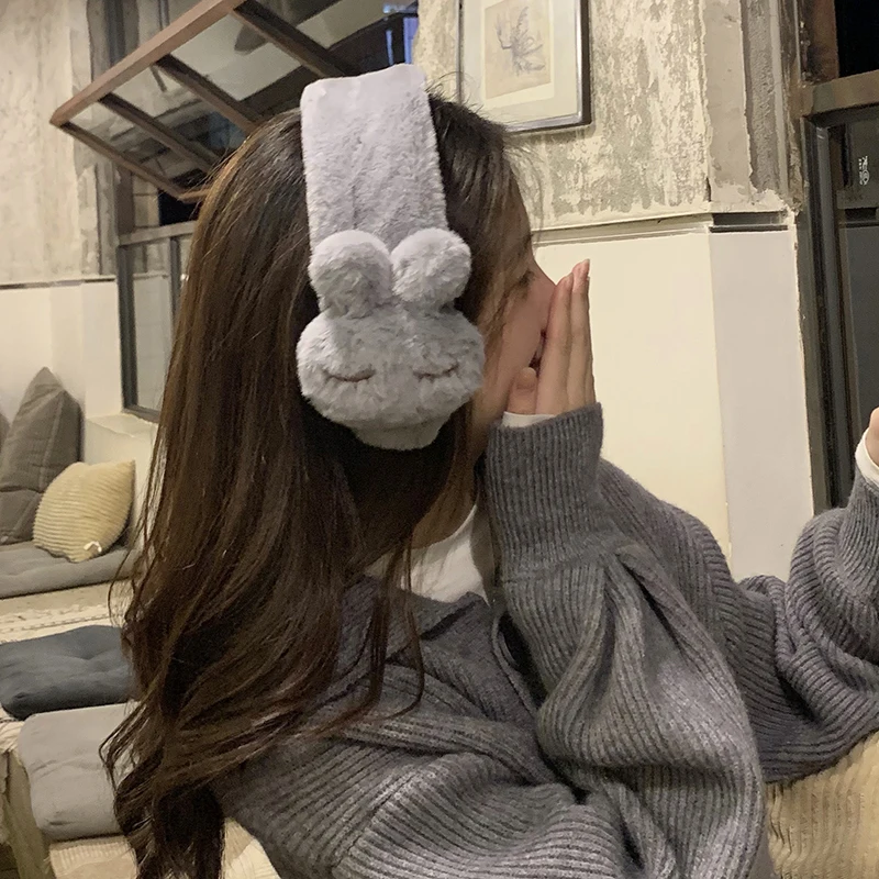 

cartoon young girl heart bunny ears earmuffs