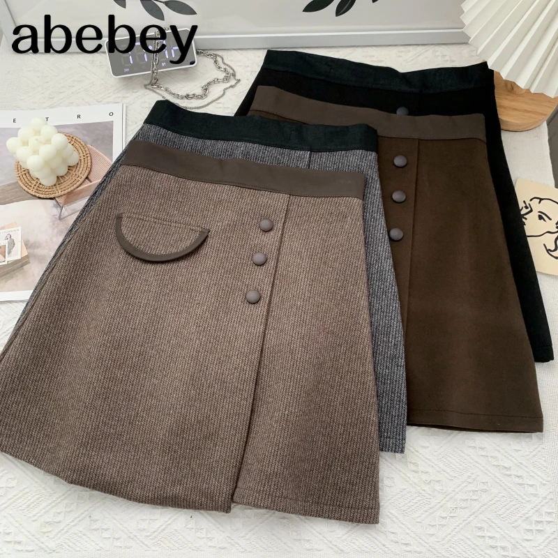 

Vintage versatile woolen Skirt PU leather patchwork single breasted high waist short A-line Skirt 2021 New Autumn Winter