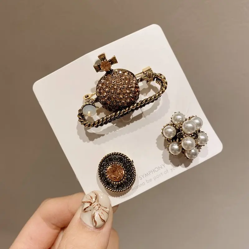 

Korean Retro Pearl Planet Brooch Geometric Creative Universe Saturn Jewelry European And American Metal Wind Pin Brooch Women
