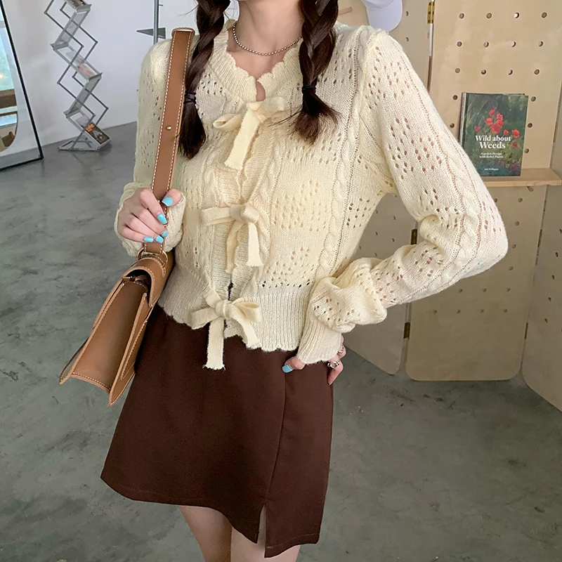 

Autumn Girl Hollow-out Drawstring Bow Knitting Cardigan + Sling Vest Two Pieces Suit