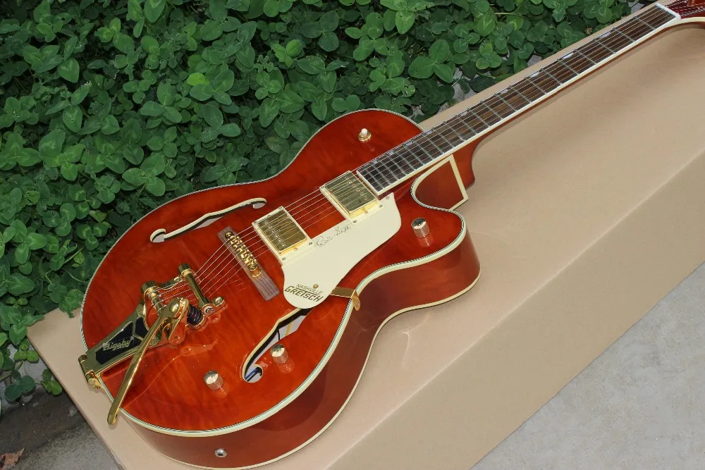 

Custom shop,Tiger Flame F hollow body jazz electric guitar.Gold hardware.vibrato system.Rosewood fingerboard jazz gitaar.