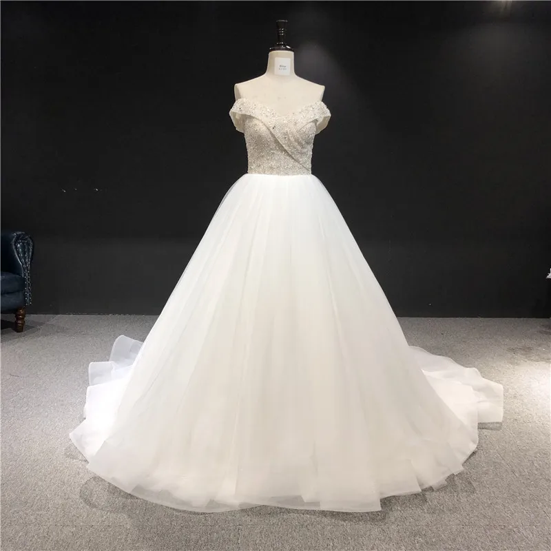 

Newest High Quality 100%Real Sample Ivory Sweat Heart Sleeveless Ball Gown Heavy Beadings Floor Length Wedding Dress