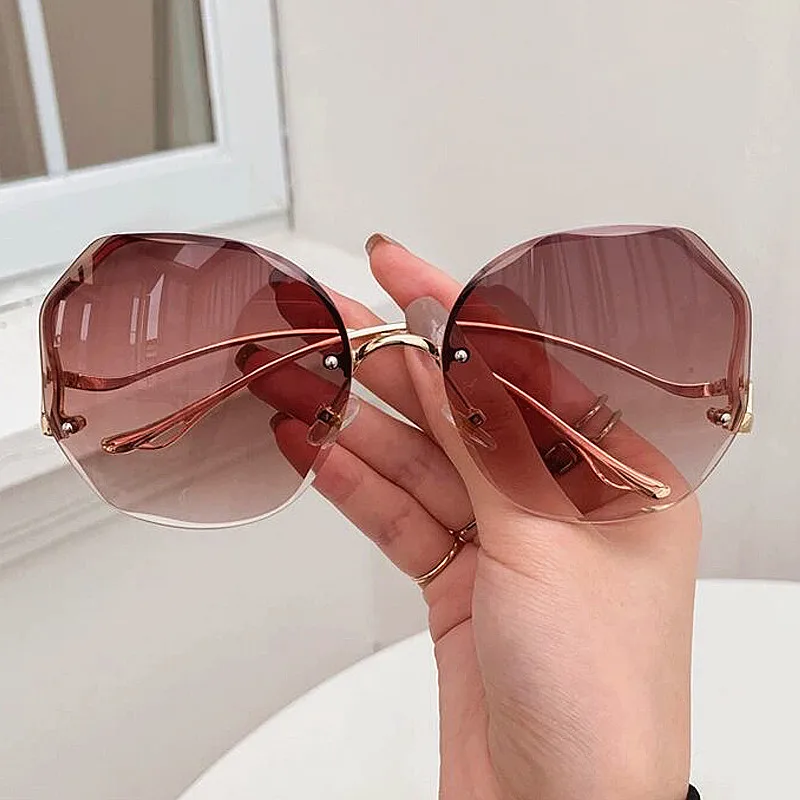 

Cutting Rimless Round Sunglasses For Women Vintage Alloy Gradient Bent Leg Sun Glasses Female Elegant Brown Pink Cat Eye Shades