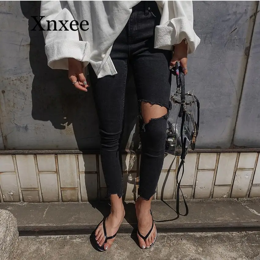 

Черные длинные брюки с дырками Корейская версия узкие эластичные узкие брюки с девятью коленями неровные пушистые черные джинсы с дырками