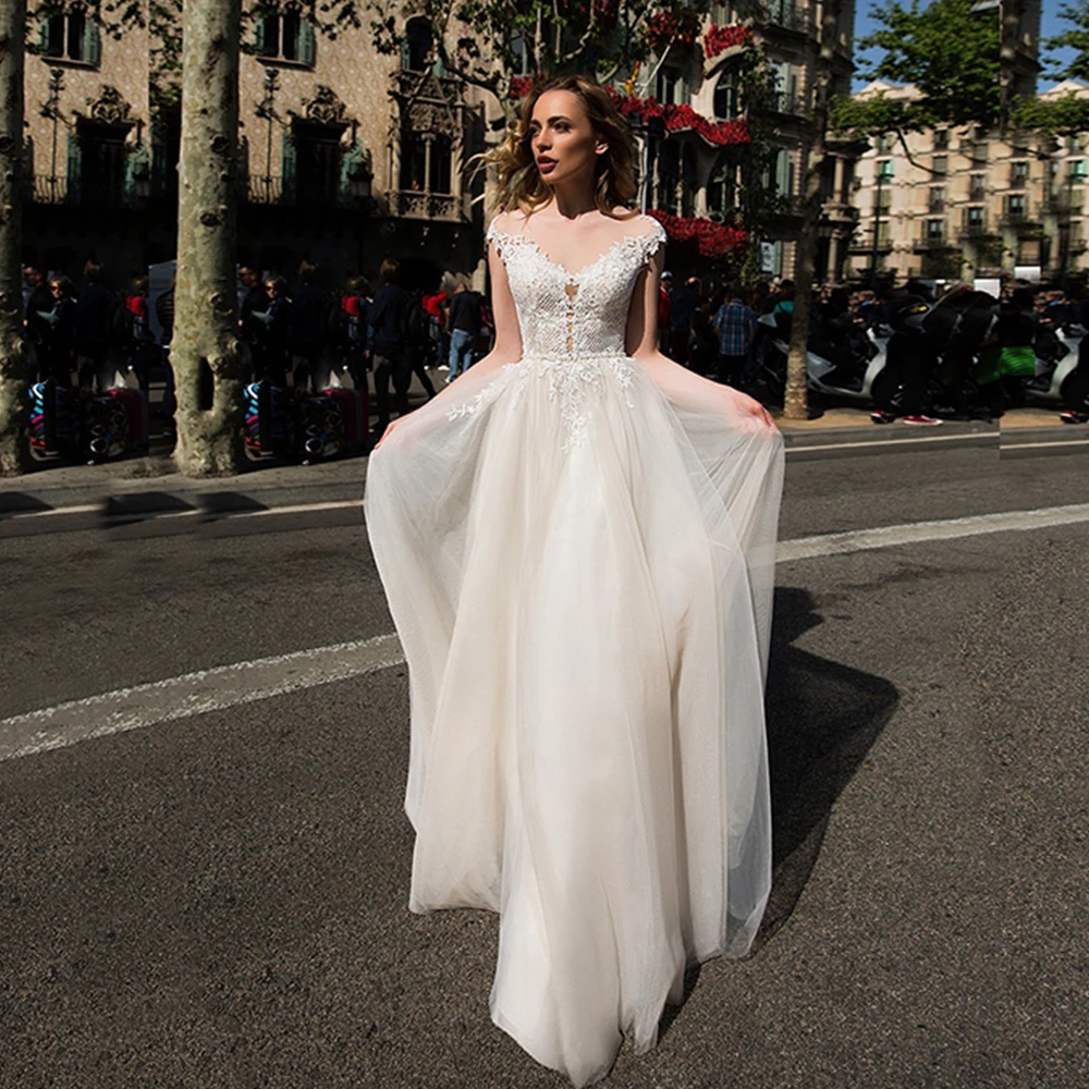 

2021 Charming Lace Cap Sleeves Wedding Dresses Illusion Boat Neck Appliques Beading Belt Wedding Dress for Bride Buttons Back
