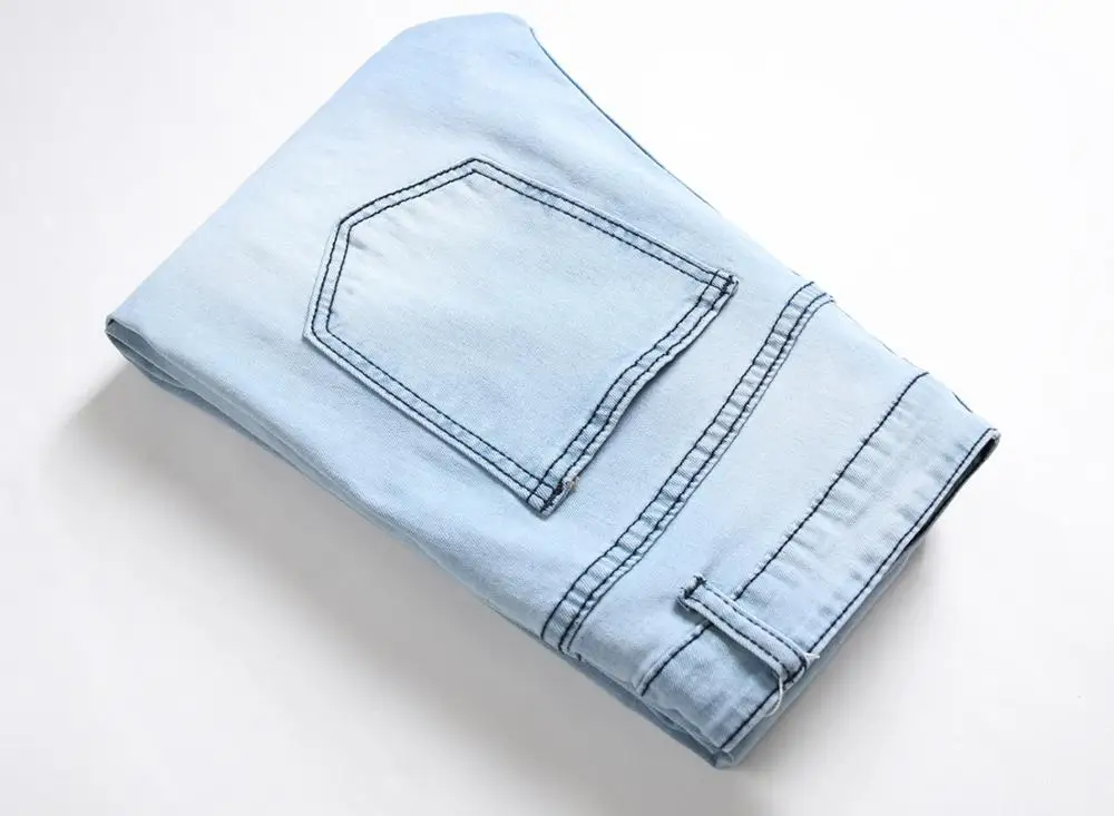 

New men's male trousers European American new style ripped denim elastic foot zipper fashion light blue fashion pants