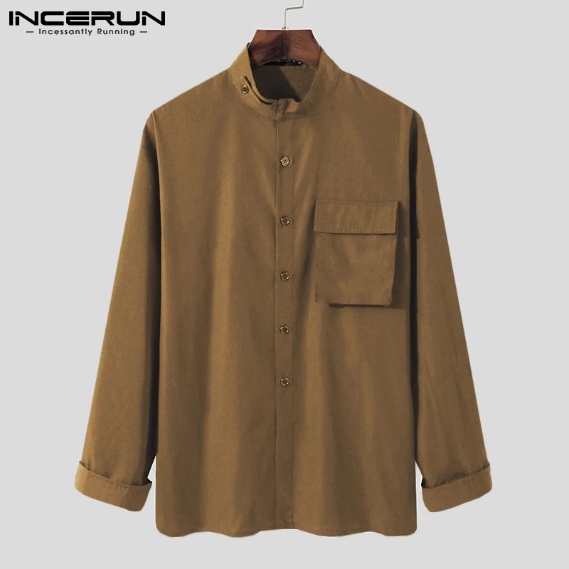 

Рубашка мужская однотонная с воротником-стойкой, длинным рукавом и карманами