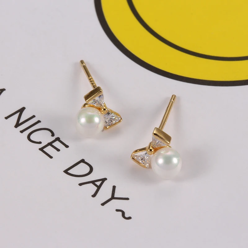 

Women's Earrings S925 Silver color Bow Pearl Inlaid Zircon Earrings Charm Personality Small Earrings Give Girlfriend Gifts