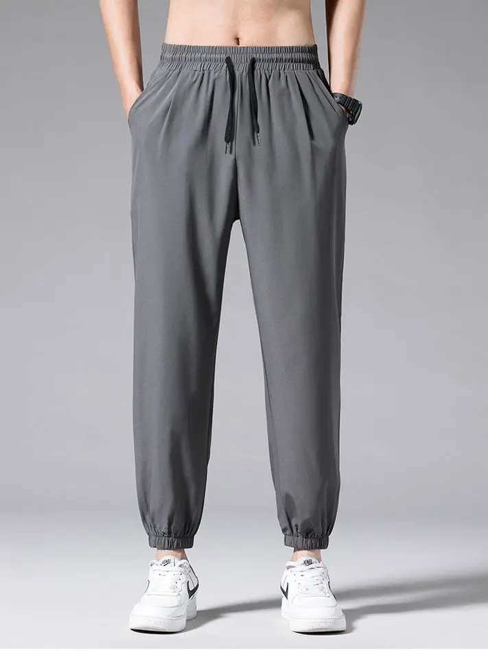 

Брюки спортивные мужские свободного покроя, тонкие модные штаны из полиэстера, с карманами, Повседневная Уличная одежда в Корейском стиле, ...