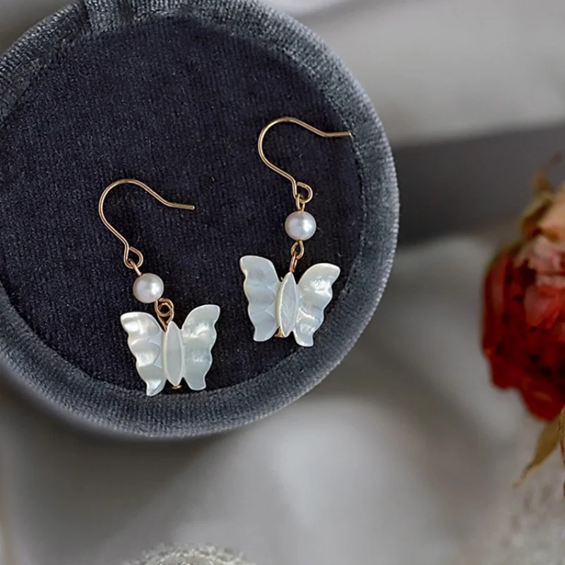

TrendyJewelry White Butterfly Drop Earrings Sweet Design Natural Freshwater Pearl Dangle Earrings For Women Girl Gifts