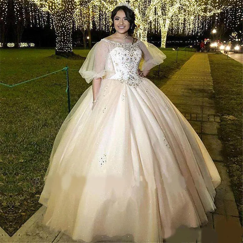 

Arabic Luxury Crystal Beaded Bateau Neckline Illusion Half Sleeves Ball Gown Evening Dresses With Sweep Train Plus Size Quincean