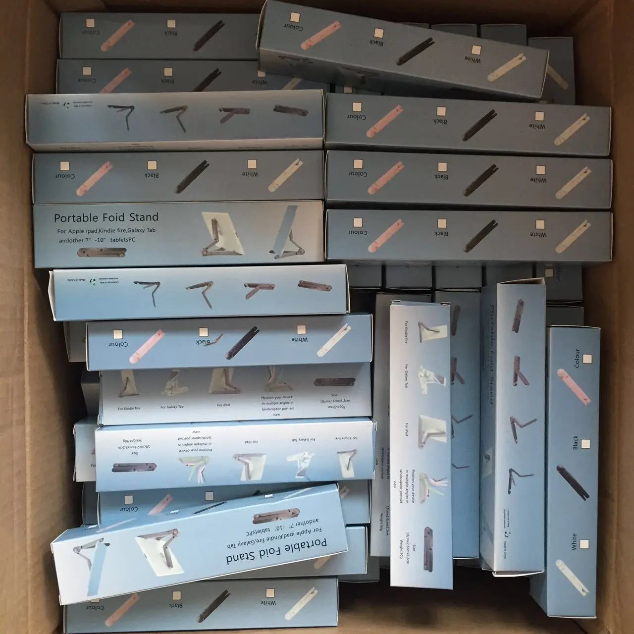 

Shows the general lazy triangle cell phone desktop folding tablet holder