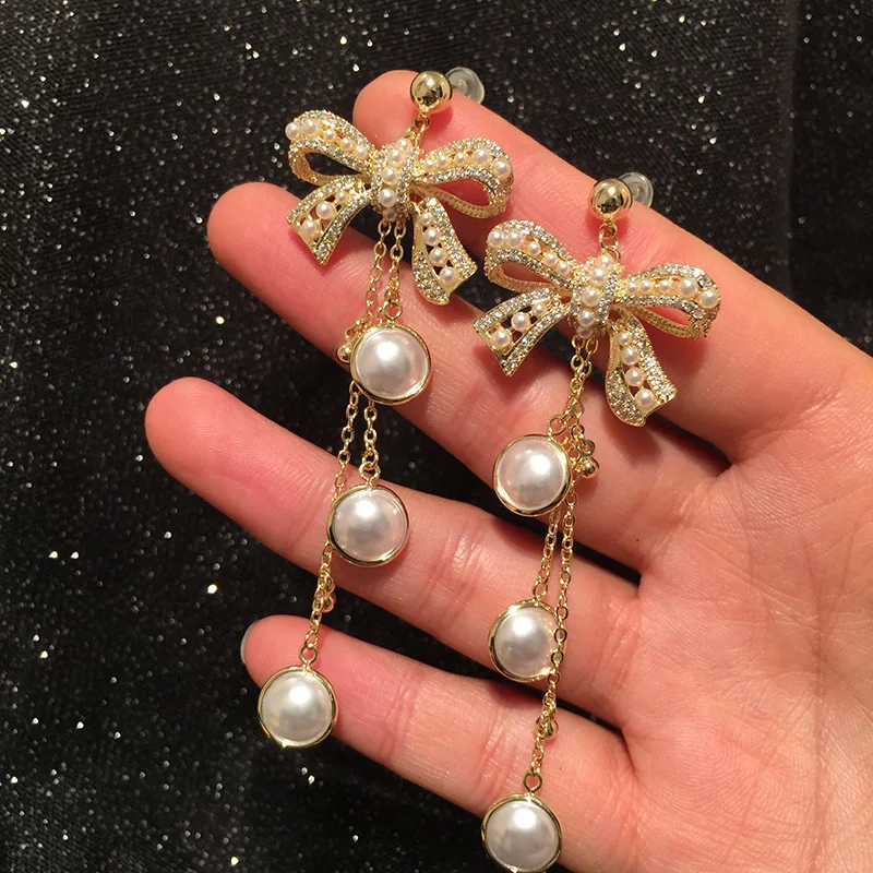 

S925 Silver Needle Small Fragrant Wind Slightly Inlaid Gold Bowknot Pearl Tassel Earrings Luxurious Sweet and Elegant Earrings