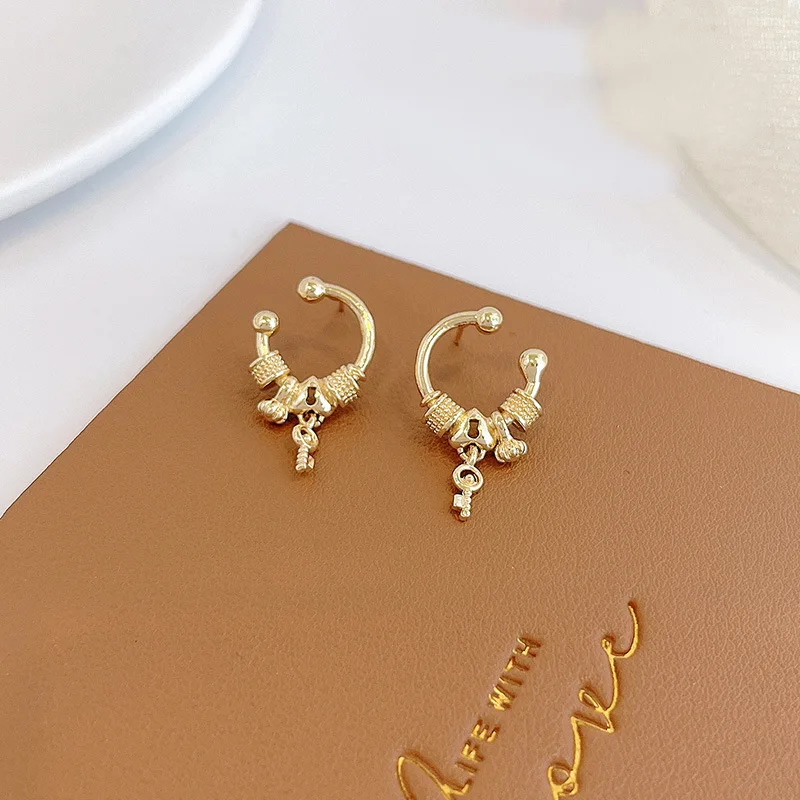 

Fashion retro gold alloy women's earrings 2021 trend key pendant multi-element Personality Tiny Ear Studs Jewelry for women