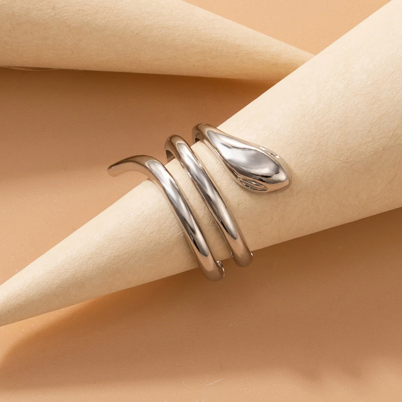 Женское кольцо с бантом и змеей в виде сердца