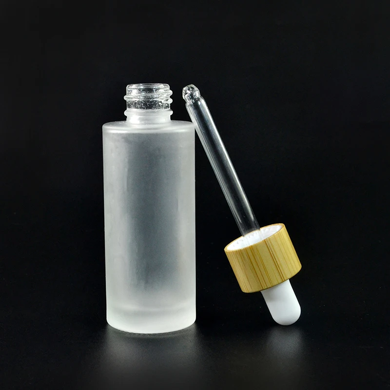 Wholesale Custom Empty Frosted Glass Skin Care Bamboo Dropper Cap Essence Oil Bottle with Lid for Cosmetics