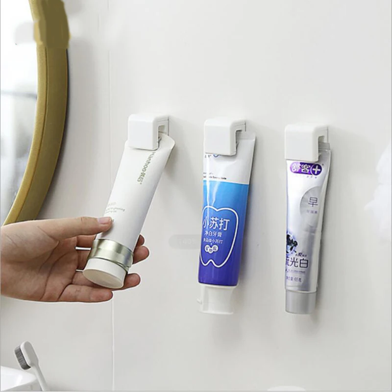 

Self Adhesive Toothpaste Rack Hanging Holder Facial Cleanser Clip Wall Mount Stand Organizer Bathroom Accessories