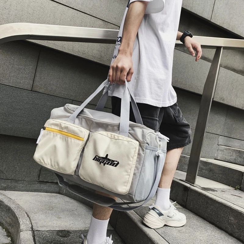 

Travel bag men's large-capacity sports gym bag women's multi-pocket short-distance business trip shoulder carry hand luggage bag