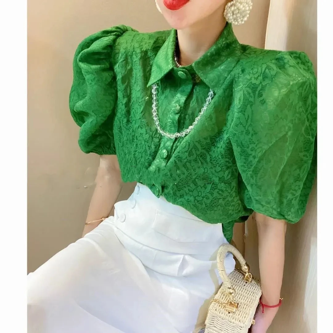 

2021 summer new lapel puff sleeve floral loose blouse shirt design sense French western style slightly transparent shirt